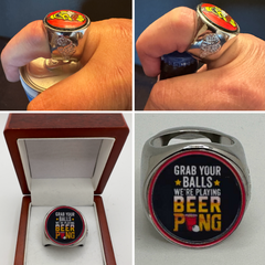 The deCAPitator GRAB YOUR BALLS WERE PLAYING BEER PONG Ring bottle cap and can tab opener! Ring sizes 6 to 15 with ring sizer. Box not included.