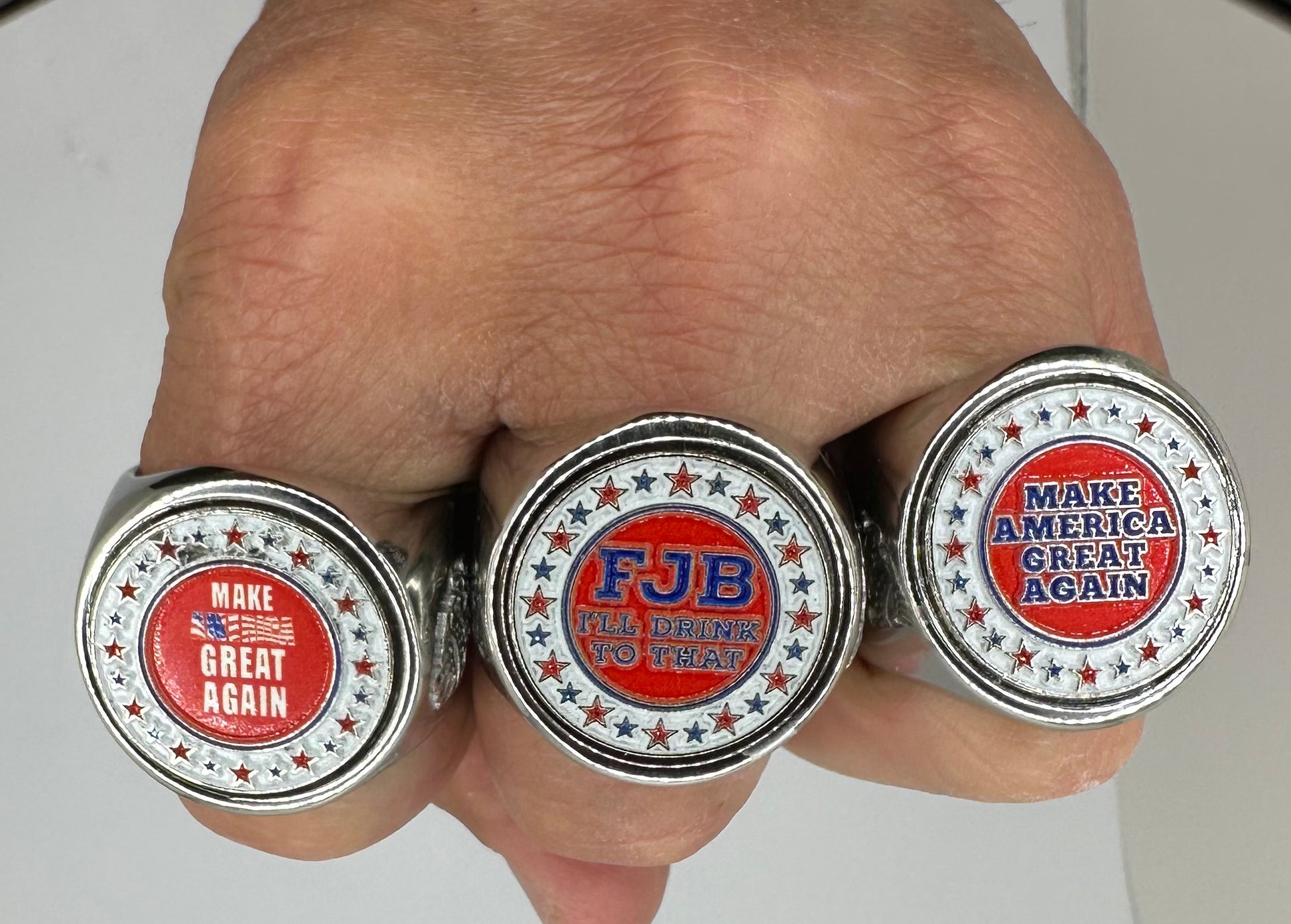 The deCAPitator MAGA collection of ring bottle cap and can tab openers cracks open your favorite beverage 