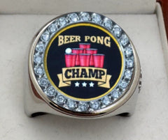 The deCAPitator BEER PONG CHAMP Ring bottle cap and can Ring goes on your middle finger for best leverage.