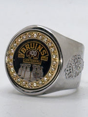 The deCAPitator BRUINS CENTENNIAL 1924 to 2024 ring bottle cap and can tab opener. Sizes 6 to 15 with ring sizer. Made of stainless steel.
