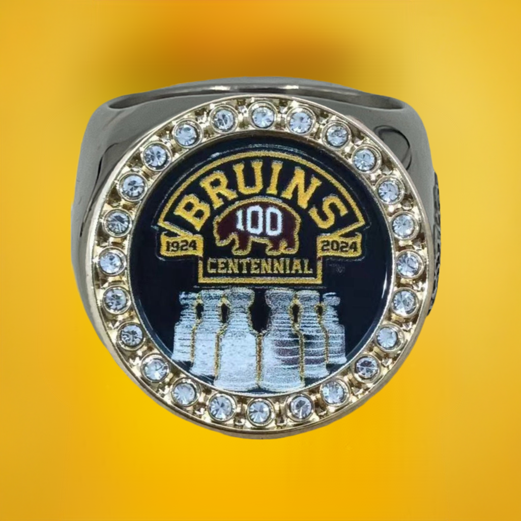 The deCAPitator BRUINS CENTENNIAL 1924 to 2024 ring bottle cap and can tab opener. Sizes 6 to 15 with ring sizer. Made of stainless steel.